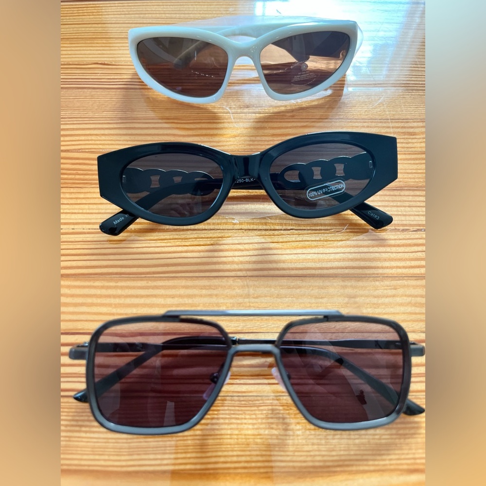 3 pairs of sunglasses: black, white and brown